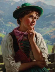 Mädchen in traditioneller Tracht in einer Alpenlandschaft